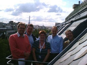 team with Paris skyline