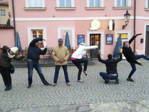 Team using their bodies to spell Prague