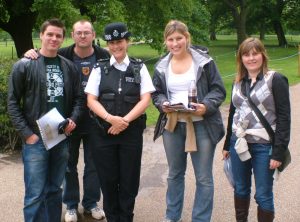 team asking a policewoman